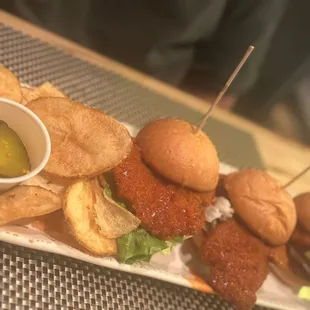 a plate of burgers and chips