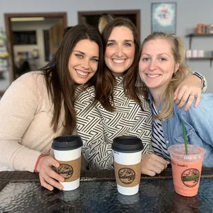 three women sitting at a table