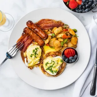Eggs Benedicts, a side of fruit and a mimosa!