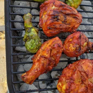 chicken and vegetables on a grill