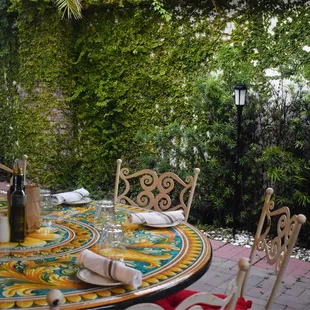 a patio with a table and chairs