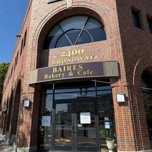 Outside entrance! At the corner of the intersection.