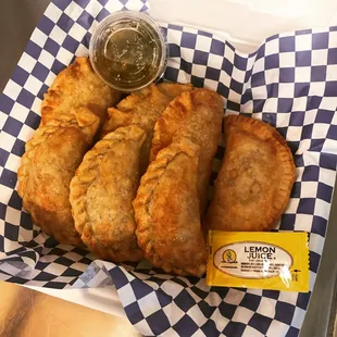 Empanadas with chimichurri sauce on the side.. beef , chicken and shrimp