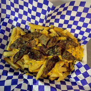 Steak fries. Cheese fries with grilled steak and a tad bit of homemade chimichurri