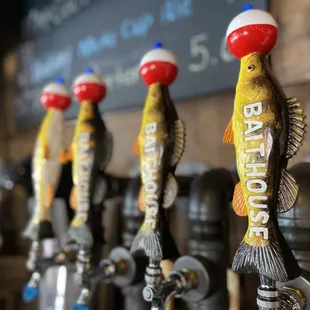 a row of beer taps