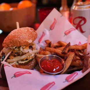 The Bait Shop burger with a side of fries.