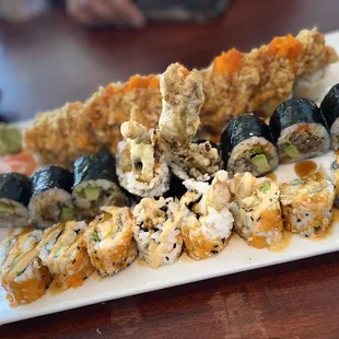 From top to bottom-  Volcano roll  Spider roll  Shrimp tempura roll