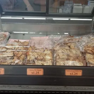 Various handmade meat pastries. Zoom up to see name of item and prices.