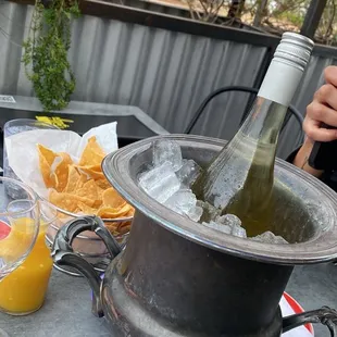 a bottle of wine in an ice bucket