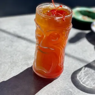 a drink in a glass on a table