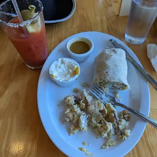 Big delish Bloody Mary and giant breakfast burrito, salsa and crema