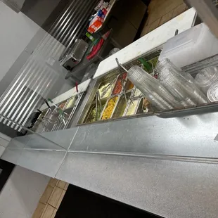 a counter with a variety of food items