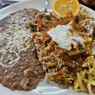 Machaca with ranchera sauce and sour cream on top.