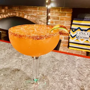 a margarita with a lime garnish
