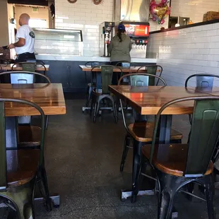 a restaurant with tables and chairs