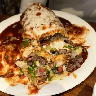 Carne asada burrito with rice &amp; red sauce