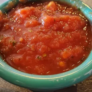 a bowl of salsa on a table