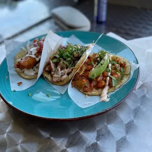 two tacos on a blue plate