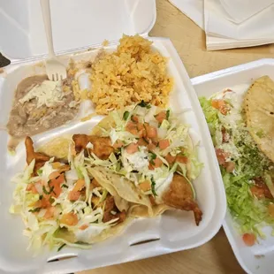 two takeout containers of food