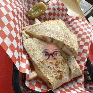 a man&apos;s face on a tortilla