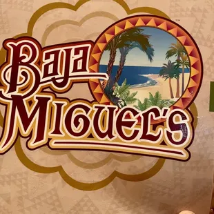 a hand holding up a sign