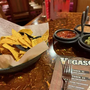 Warm chips and salsa, beans, and guacamole.