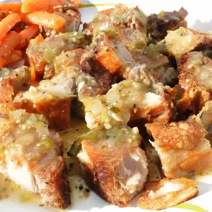 Homemade Chiharones, crispy skin pork  belly served with our spicy Salsa Verde