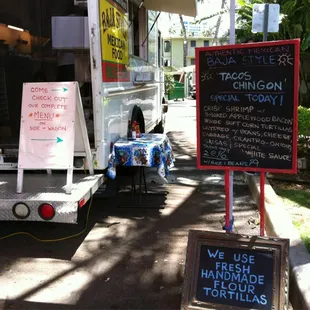 a food truck with a menu