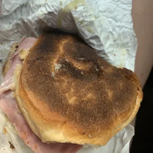 a ham and cheese sandwich wrapped in foil