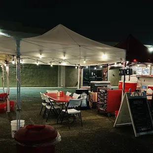 truck and tent at night.