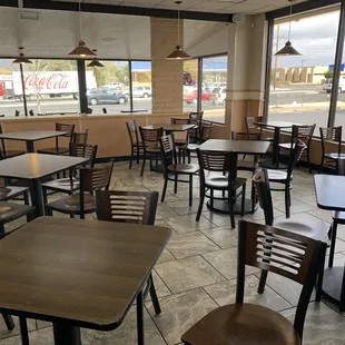 empty tables and chairs in a restaurant