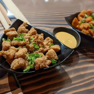 a plate of fried food and dipping sauce