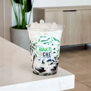 a cup of iced coffee on a table