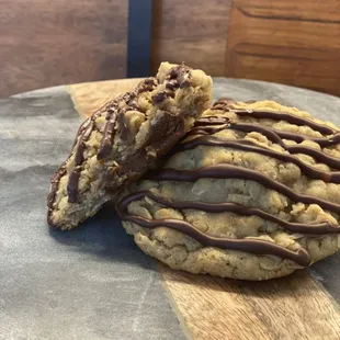 two cookies with chocolate drizzle