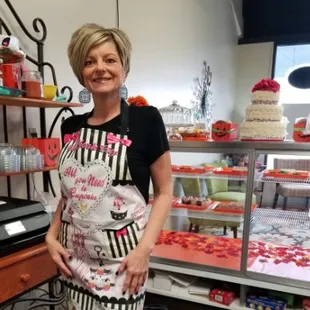 a woman standing in a bakery