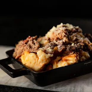 Brisket Mac
 
 Mac topped with shaved brisket &amp; parmesan cheese.