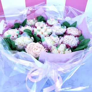 a bouquet of cupcakes wrapped in plastic