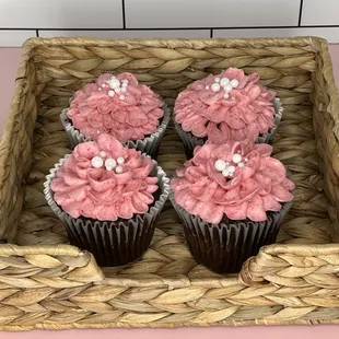 pink cupcakes in a basket