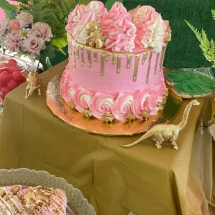 Gold and pink dinosaur cake