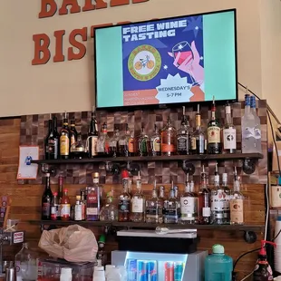 a bar counter with a television above it