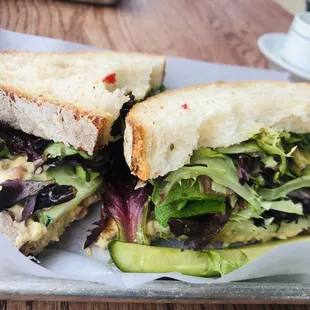 Texas Fresh. Sourdough bread with humus, greens, cucumber , pesto...