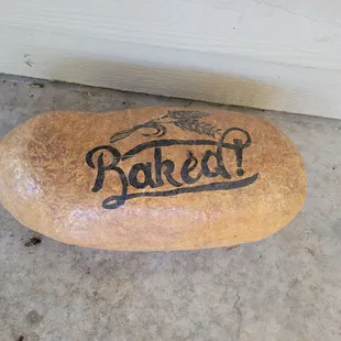 Big rock, that looks like a loaf of bread, used as a doorstop.  Pretty cool.