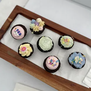 mini chocolate cupcakes with vanilla bean buttercream for a birthday party