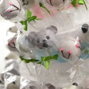 a bunch of panda cake pops
