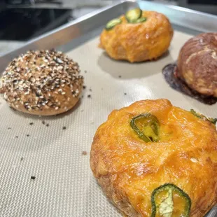 a variety of pastries on a baking sheet
