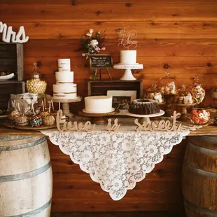 Dessert table - 3 white cakes (lemon poppyseed, carrot, and chocolate mudslide) with buttercream frosting, were perfect for our wedding.