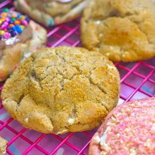 a variety of cookies on a wire rack