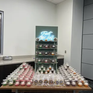 Corporate event catering. Cookie display wall with cupcakes. Cookie and cupcakes individually packaged.