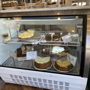 Display case of desserts. I bought a slice of Carrot Cake with Pecans, and Apple Crumb cake