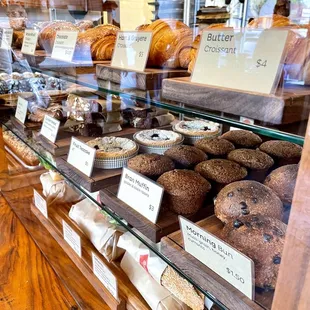 Pastry case with Butter Croissant, Chocolate Croissant, bran muffins, morning buns, and more.